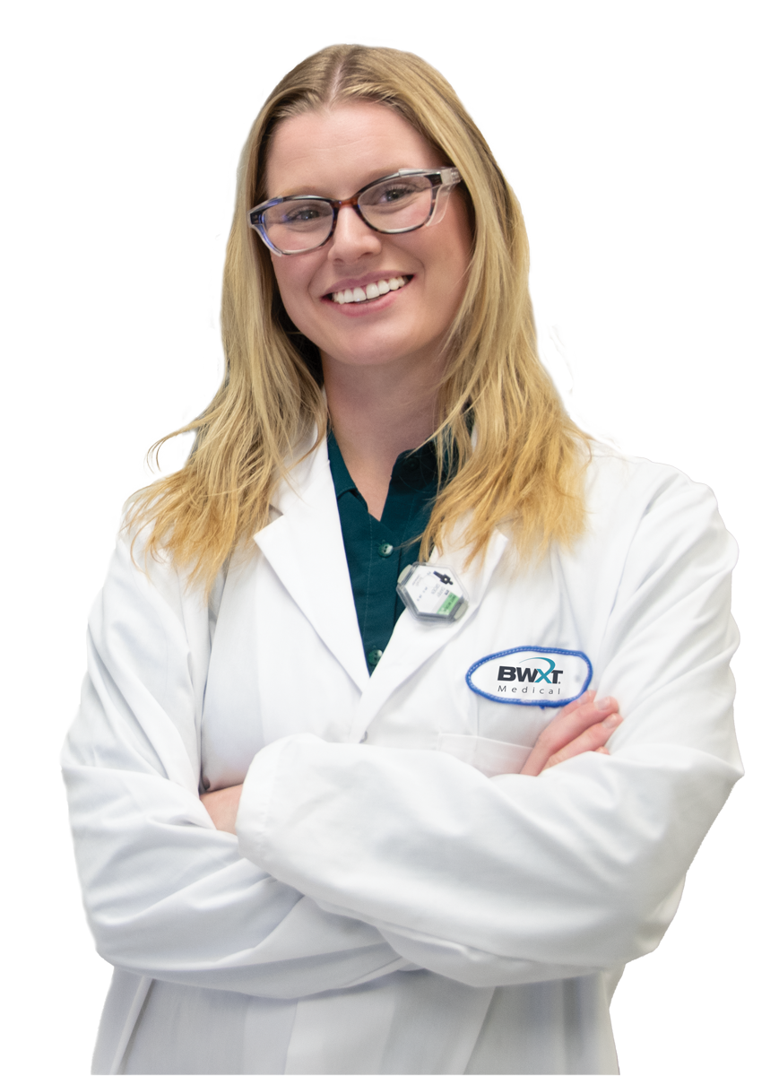 Young woman smiling in labcoat.